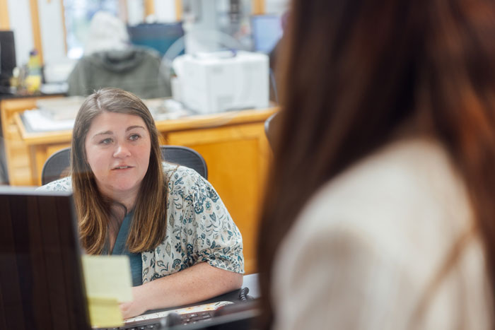 Barbour Health receptionist with patient.